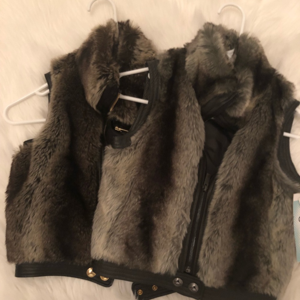 Two fur vests.